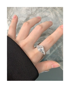 Detail of silver S925 ring featuring a large rectangular zircon stone on model hand