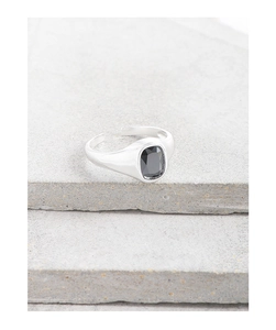 Close-up of adjustable silver ring featuring a large rectangular black zircon stone