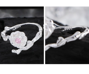 Macro shot of S925 silver rose ring with vintage branch texture and pink zircon stone