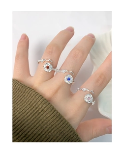 Detailed view of S925 silver rose rings with red, blue, and pink zircon gemstones