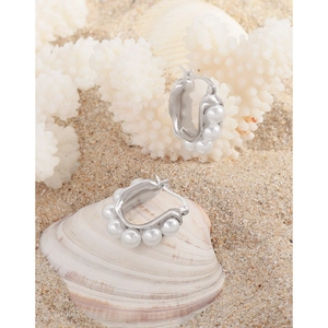 Elegant S925 sterling silver U-shaped hoop earrings with pearls on a beach setting