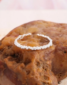 Macro detail of S925 sterling silver beaded ring featuring a clear hallmark stamp