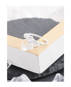 Macro shot of S925 sterling silver ring with knotted lines and sparkling zircon stone
