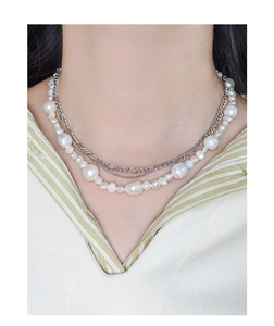 Close-up of S925 silver double-layer necklace with irregular baroque pearls on a model