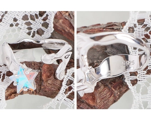 Macro shot of S925 sterling silver stamp and colorful star zircon on irregular band