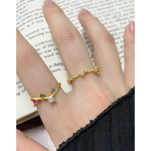 Elegant gold S925 silver open rings with colorful zircon in a stacked lifestyle shot