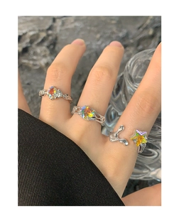 Detail of S925 silver liquid metal rings with holographic zircon stars and hearts