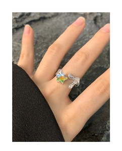 Macro shot of S925 sterling silver ring with aurora zircon star and fluid metal design