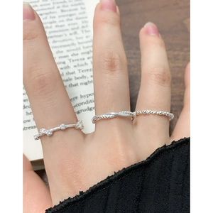 Three-piece set of S925 sterling silver geometric zircon rings on a model's hand