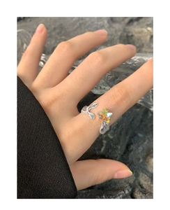 Macro view of S925 sterling silver liquid metal ring with colorful star zircon