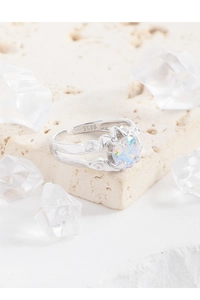 Macro view of S925 sterling silver ring with textured band and iridescent zircon stone