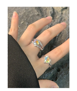 Detail of S925 silver liquid metal rings with colorful heart and star zircons