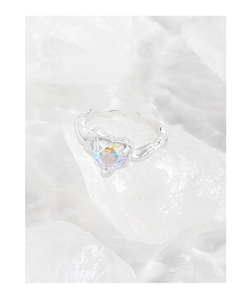 Macro detail of S925 sterling silver ring with colorful heart zircon on white crystals