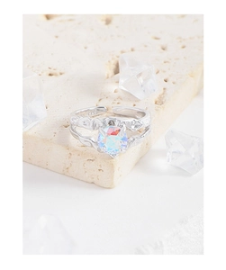 Macro detail of S925 sterling silver stamp and colorful zircon on a textured ring