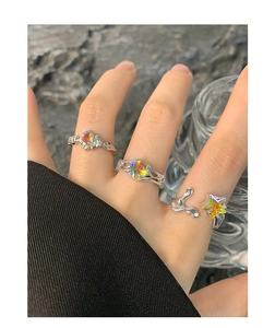 Detail of three S925 silver lava-style rings with colorful heart and star zircons