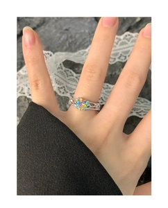 Detail of S925 silver ring featuring heart-shaped iridescent stone with wrinkled texture