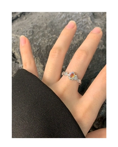 Macro detail of irregular S925 silver ring featuring a vibrant aurora zircon stone