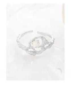 Detailed shot of S925 sterling silver irregular lava ring with moonstone center