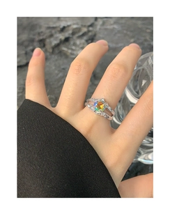 Macro detail of S925 silver ring with textured band and iridescent round zircon stone