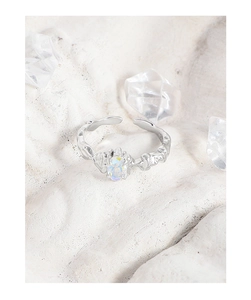 Macro detail of S925 silver irregular lava ring with colorful opal zircon stone