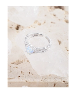 Detailed view of S925 silver tree branch ring with heart-shaped iridescent opal stone