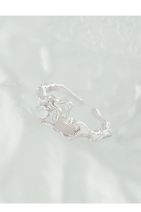 Detailed macro view of S925 sterling silver ring with opal stone and unique liquid texture