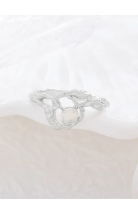 Detail of S925 silver irregular lava ring featuring a translucent round opal gemstone