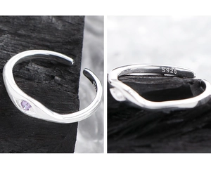 Macro shot of S925 sterling silver ring featuring purple zircon and hallmark engraving