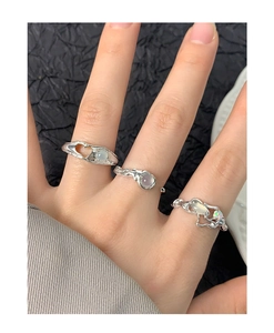 Close-up of S925 silver irregular textured rings set with opal and moonstone gems