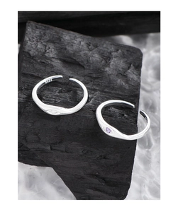 Detail of S925 sterling silver adjustable rings with eye motif and inlaid gemstones