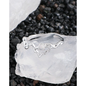 Irregular silver S925 ring with white agate stone on white mineral stone background