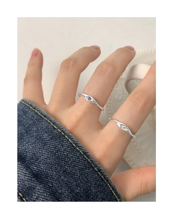 Close-up of S925 silver rings with purple and white cubic zirconia stones on hand