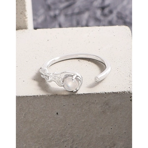 S925 sterling silver ring with white agate gemstone on industrial cement background