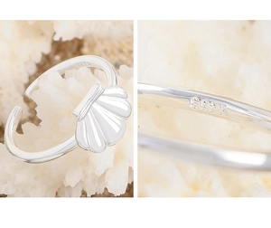 Macro view of S925 sterling silver hallmark and shell design on adjustable ring