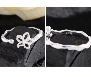 Close-up of S925 sterling silver hollow flower ring showing the hallmark engraving