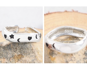 Detailed macro view of S925 sterling silver ring showing the hallmark and black enamel art
