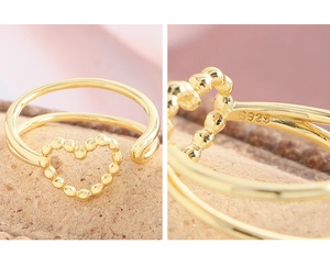 Detailed macro shot of the S925 silver stamp on gold-plated double-layer heart ring