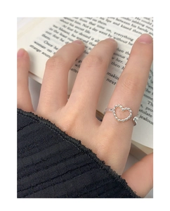 Detail of S925 silver hollow heart ring showing twisted rope texture and open design