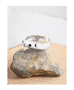 Detailed macro shot of S925 sterling silver ring featuring heart and moon engraving