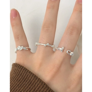 Minimalist silver S925 stacking rings set with knot and crystal pave designs
