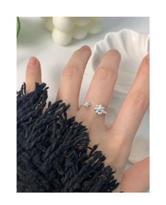 Detail of adjustable S925 silver ring featuring delicate 3D flowers on model hand