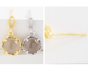 Close-up of S925 sterling silver hallmark and smoky quartz gemstone stud earrings