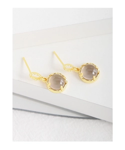 Detail of S925 silver stud earrings with smoky quartz and gold hammer texture