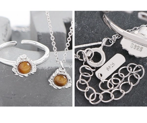 Makroaufnahme von S925 Sterlingsilber-Set mit braunem Tigerauge-Stein auf Steinhintergrund