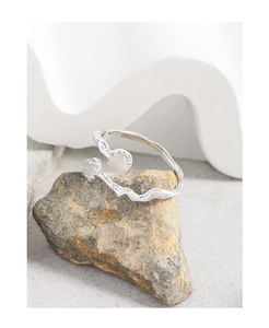 Detail of S925 sterling silver ring featuring organic textures and dual round gemstones