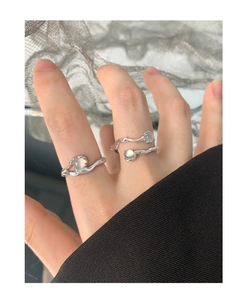 Detail of S925 silver irregular rings with translucent agate gems on hand