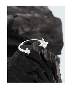 Macro view of adjustable S925 sterling silver star ring with sparkling cubic zirconia stones