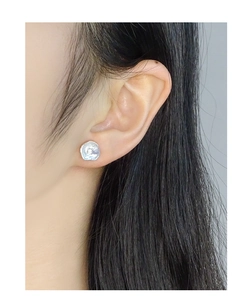 Detailed view of S925 sterling silver stud earring with baroque irregular lava texture