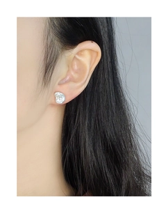 Close-up of S925 silver stud earring with baroque lava texture on model ear