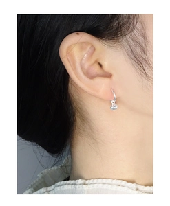 Side view of woman wearing S925 sterling silver lucky bag drop earrings for daily use